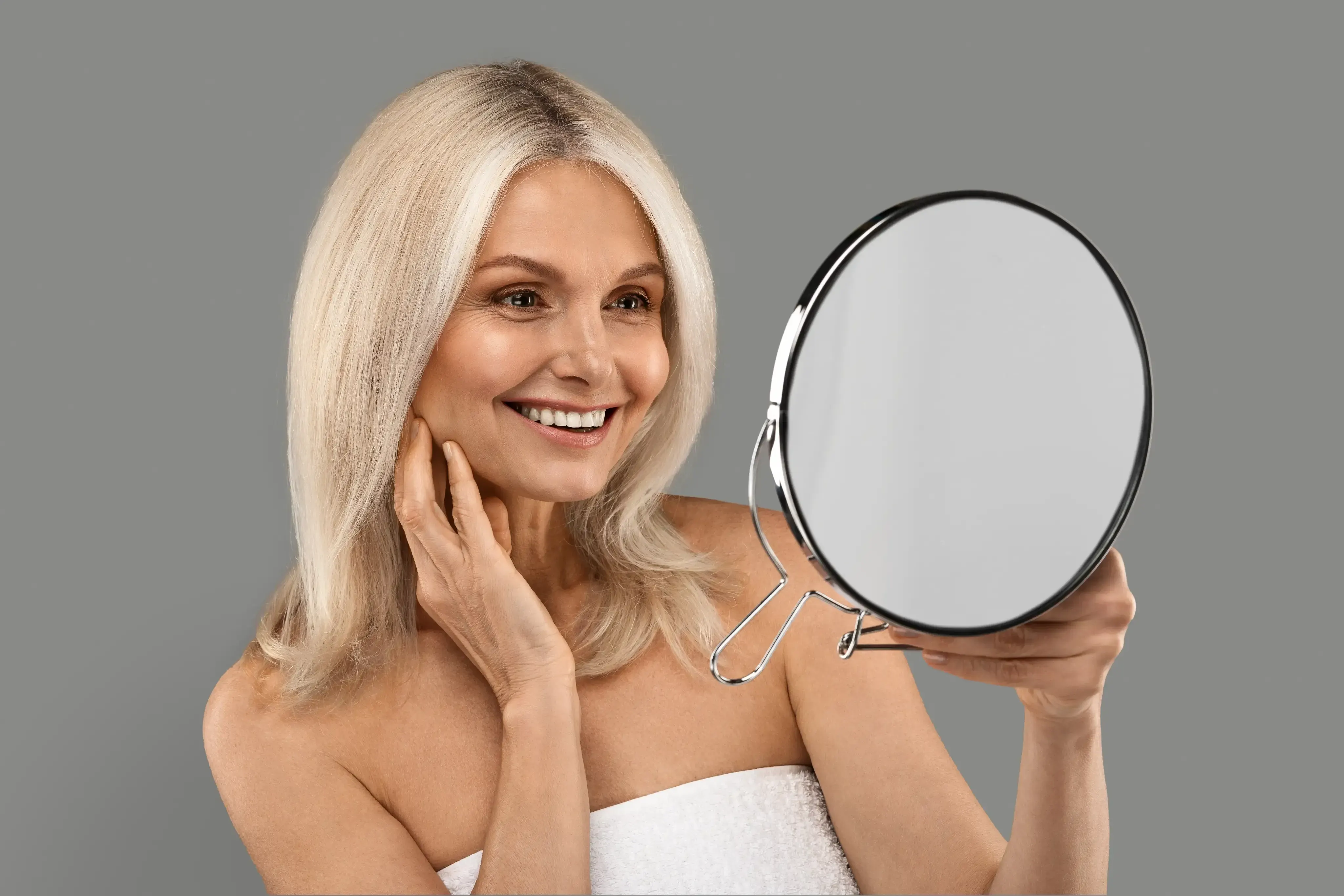 Mature woman with radiant skin from anti-aging IV beauty infusions at spa